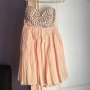 Mini dress with gold detailing on the front